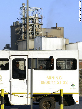 Miners arrive at the Marikana mine on August 21 after owners Lonmin gave striking workers until 0500 GMT to return to their jobs or face dismissal. 