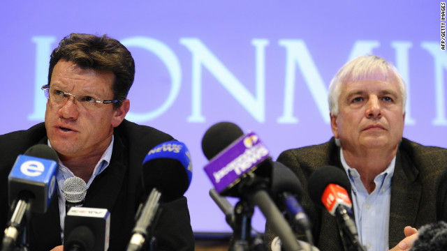 Mark Munroe (left), executive vice president for mining at Lonmin, sits alongside the company's chief financial officer Simon Scott during a press conference in Marikana on August 20. 