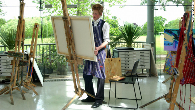Prince Harry paints in Eton College's new Drawing Room on May 12, 2003.