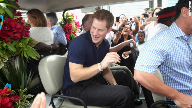 Prince Harry climbs on board a specially decorated golf buggy as he goes on a tour of Harbour Island in Nassau, Bahamas, on March 4, 2012. The Prince was visiting the Bahamas as part of a Diamond Jubilee tour as a representative of Queen Elizabeth II.