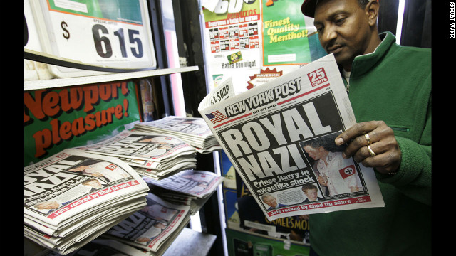 A man reads the New York Post newspaper on January 13, 2005, featuring the "Royal Nazi" headline about Prince Harry who attended a fancy dress party wearing a khaki uniform with an armband emblazoned with a swastika.