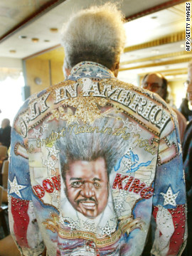 King shows off his "Only in America" denim jacket at a 2003 press event. While he publicly embraces the caricature of himself that he has spent decades creating, King is often quiet and deep in his thoughts when he's out of the limelight, according to his son, Karl.