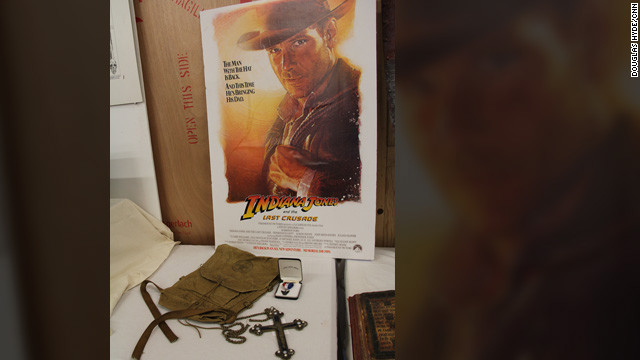 Props from the opening sequence of "Indiana Jones and the Last Crusade" -- young Indy's Boy Scout backpack, Eagle Scout ribbon and the Spanish crucifix he encounters ("It belongs in a museum!!")