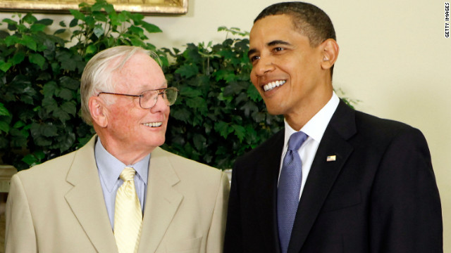 President Barack Obama poses for photographs with Armstrong in the Oval Office at the White House in 2009.