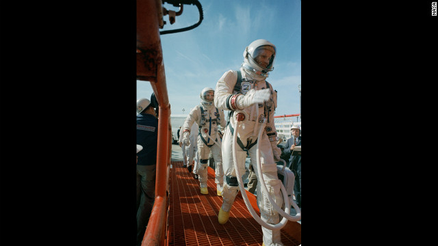 Commander Neil Armstrong, right, and pilot David R. Scott prepare for the launch of Gemini 8 on March 16, 1966. In orbit, Armstrong had to bring the capsule under control when it began to spin out of control after docking with an unmanned target vehicle, and the mission was aborted. 