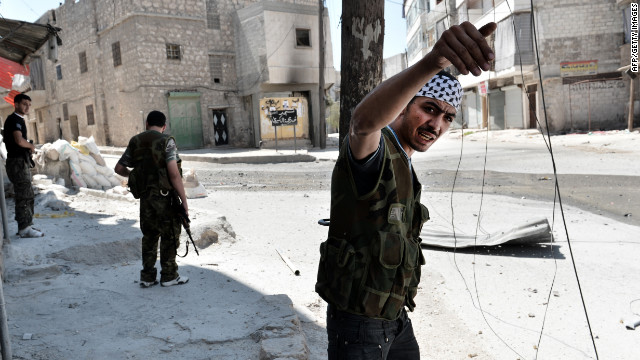A rebel fighter communicates to his commanders during ongoing fighting in Aleppo's Mashhad neighborhood.