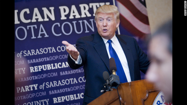 Donald Trump, who accepted the Statesman of the Year Award from the Sarasota County Republican Party, answers questions in Sarasota, Florida.