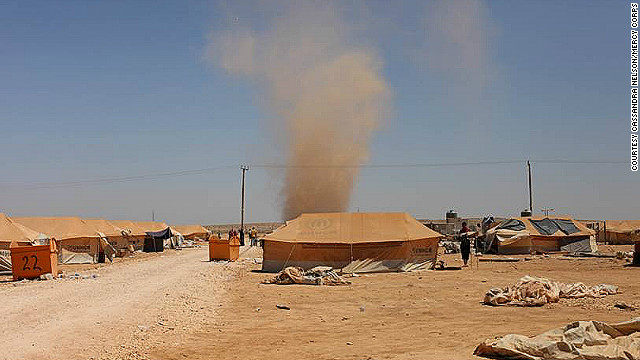 Za'atari Camp was built on a barren desert plain without a tree or shrub in sight. Severe sand storms and scorching heat have taken their toll on refugees and aid workers here.