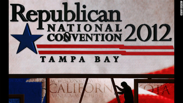 Last-minute adjustments are made to the main stage at the Tampa Bay Times Forum on the abbreviated first day of the GOP convention.