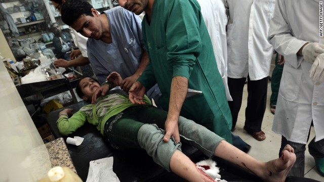 Doctors treat a wounded girl at a hospital in Aleppo, Syria's largest city, on Tuesday.