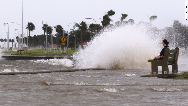 Diana Whipple of New Orleans watches waves crash on the shore of Lake Pontchartrain as Hurricane Isaac approaches Tuesday, August 28. Isaac became a Category 1 hurricane Tuesday, with maximum sustained winds of 75 mph, the National Hurricane Center says.