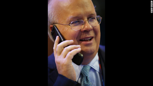 Karl Rove, former deputychief of staff and senior policy adviser to President George W. Bush, talks on a phone at the convention hall.