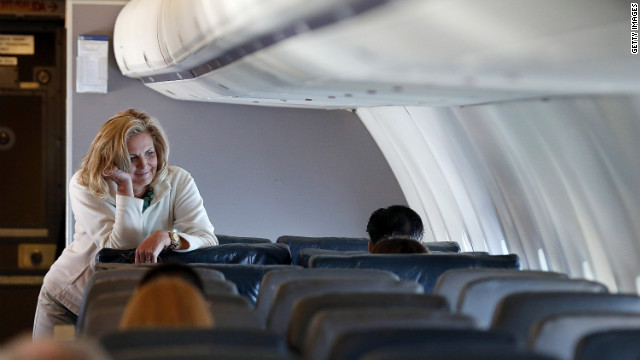 Ann Romney leans on a seat aboard the campaign plane en route to Tampa.