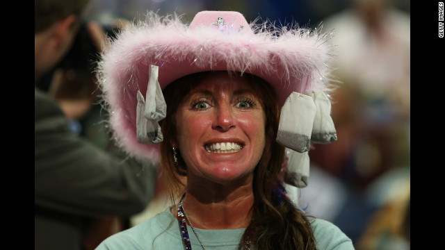 Leslie Jones of Virginia Beach, Virginia, wears a hat with tea bags attached.