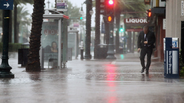  A man walks on Canal Street on Tuesday, August 28, in New Orleans, Louisiana. New Orleans is bracing for the approach of Hurricane Isaac, now a Category 1 storm, which made landfall in Louisiana's Plaquemines Parish around 8:30 p.m. tonight.