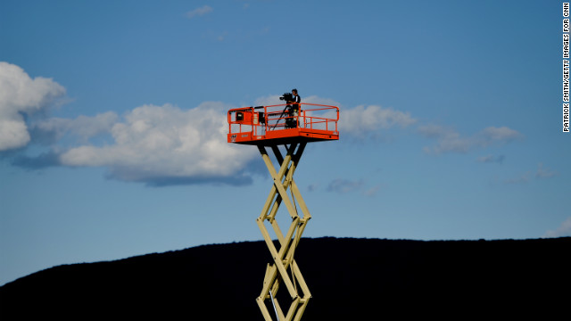 A videographer films the Penn State Nittany Lions during football practice.