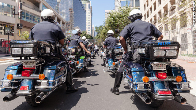 Motorcycle cops line up Sunday in the streets of uptown Charlotte.