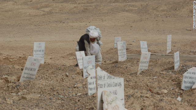 A man visits a Taliban cemetery in the Arghandab district outside Kandahar city. The Taliban fighters who get killed in attacks are usually brought here by the International Committee of the Red Cross.