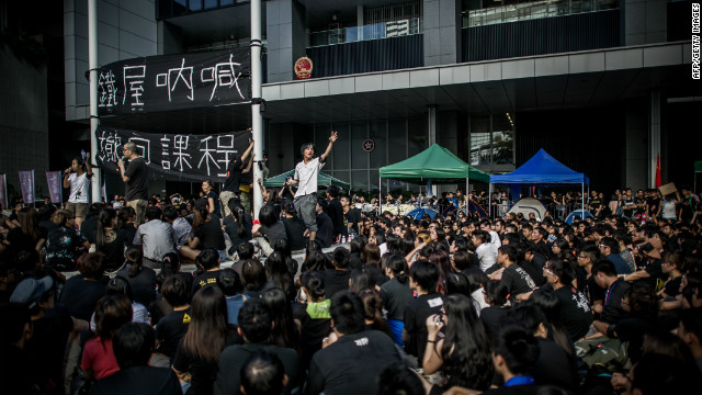 Students shout slogans in front of the Central Government Offices 
in Hong Kong on September 3, 2012.