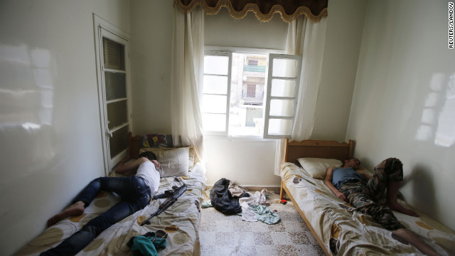 Free Syrian Army fighters sleep in a room in Aleppo on Wednesday.