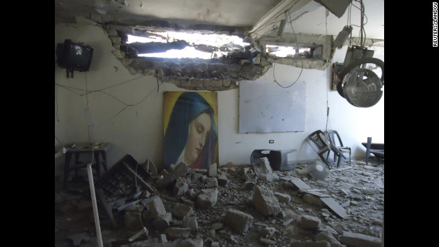 Im Al-Zinar church shows damage Tuesday in the western city of Homs.