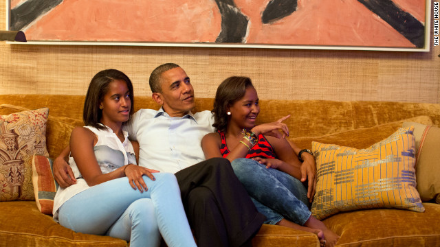 Photo: President Obama watches first lady's speech on TV with daughters
