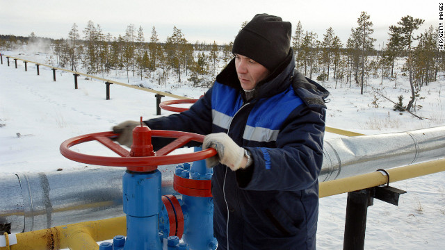 A worker opens a valve of a gas pipeline of the Russian Gazprom enterprise in Vyngayakhinsky gas fields