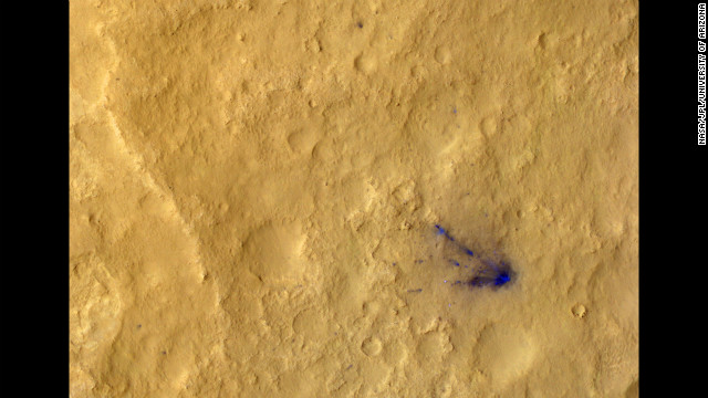 Sub-image three shows the descent stage crash site, now in color, and several distant spots (blue in enhanced color) downrange that are probably the result of distant secondary impacts that disturbed the surface dust.