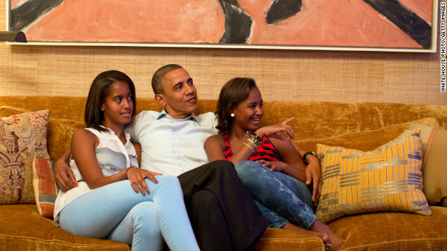 The president and daughters Malia, left, and Sasha, watch on television from Washington as Michelle Obama takes the stage to deliver her convention speech in Charlotte on Tuesday.