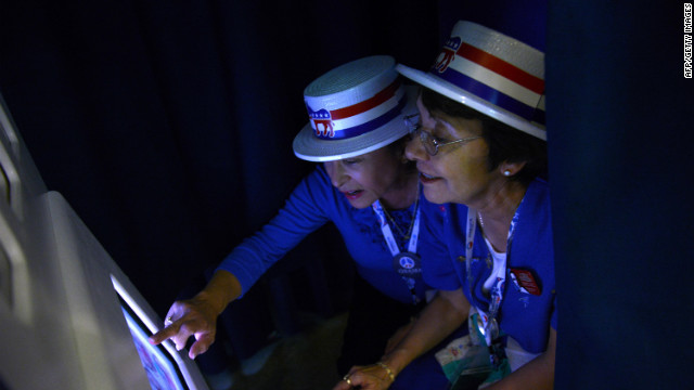 Priscilla Marquez and Evie Walls from Arizona pose in the Google photo booth at the Time Warner Cable Arena in Charlotte on Wednesday.