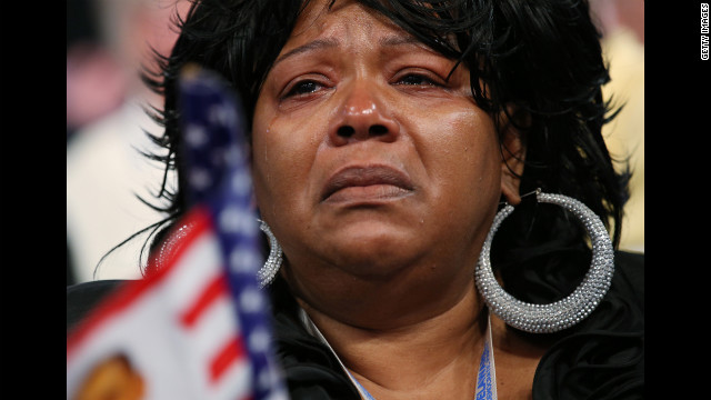 A woman cries as chairman of the Congressional Black Caucus, Missouri Rep. Emanuel Cleaver II, speaks during the DNC on Wednesday.