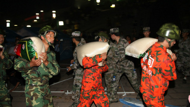 Rescuers unload supplies at an emergency relief center in Yiliang on September 8.