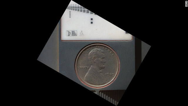 The penny in this image is part of a camera calibration target on NASA's Mars rover Curiosity. The image was taken by the Mars Hand Lens Imager camera.
