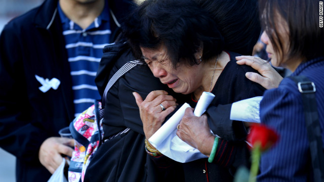 A Woman Cries During The Rememberance Ceremonies At The World Trade