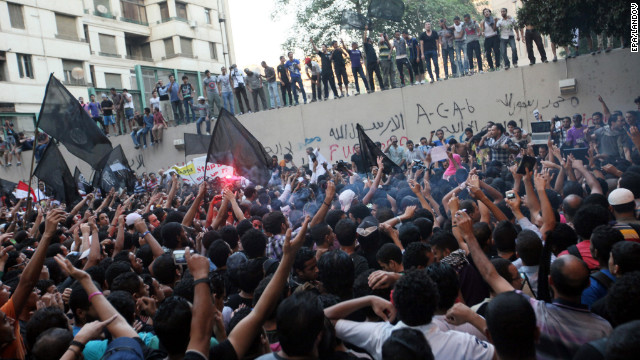 Protesters gather along the U.S. Embassy wall. 