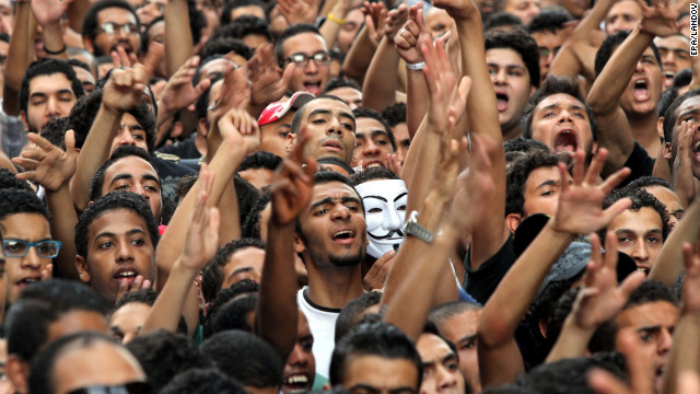 Demonstrators yell outside the U.S. Embassy.