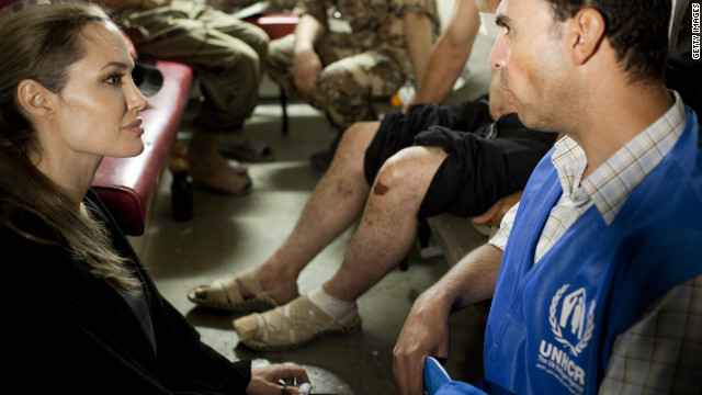 Jolie meets with refugees on the Jordanian border minutes after they crossed from Syria on Tuesday in Amman, Jordan. With shelling clearly audible and visible across the border in Syria, some 200 refugees made the dangerous crossing under cover of night. 