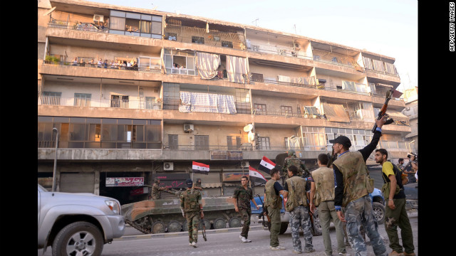 Syrian government forces take position in a residential neighbourhood in Aleppo on Saturday, September 8.