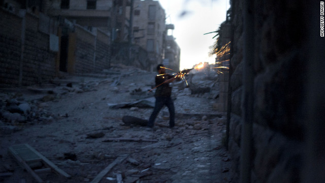 A Free Syria Army fighter fires his weapon during heavy clashes with government forces in the Izza neighbourhood of Aleppo on Sunday. 