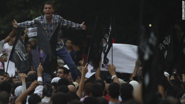 People shout in front of the U.S. Embassy in Cairo.