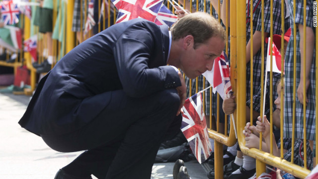 Prince William speaks to a child in the crowd on Wednesday.