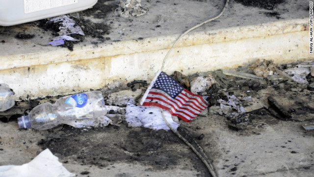 A small American flag is seen in the rubble at the U.S. Consulate on Wednesday.