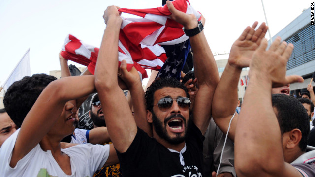 Protesters shout outside the U.S. Embassy in Tunis, Tunisia, on Wednesday, September 12. 