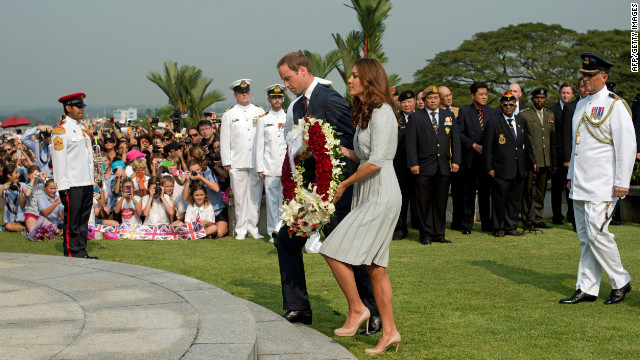 Britain's Prince William and his wife, Catherine, lay a wreath to pay their respects to WWII dead at the Kranji War Cemetery in Singapore Thursday.