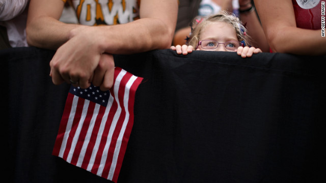 A girl listens to President Obama speak at the University of Iowa on Friday.