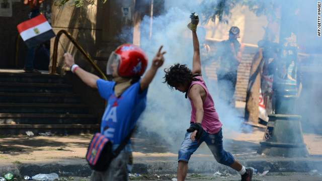 Police use tear gas on crowds protesting Thursday outside the U.S. Embassy in Cairo.