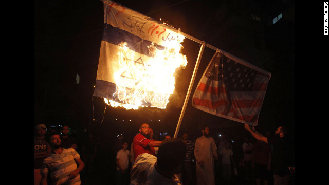 Supporters of Sunni Muslim Salafist leader Ahmad al-Assir burn an Israeli and a U.S. flag during a protest in Sidon, Lebanon, on Thursday.