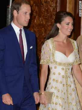 The Duke and Duchess of Cambridge attend an official dinner hosted by Malaysia's Head of State Sultan Abdul Halim Mu'adzam Shah of Kedah at the Istana Negara on Thursday in Kuala Lumpur, Malaysia. The duchess' evening gown, by Alexander McQueen, features the Malaysian flower, hibiscus, in gold detail.