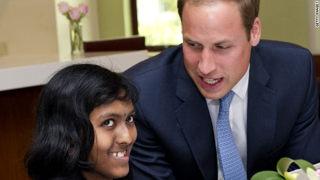Britain's Prince William speaks with Linges Warry Apparad, a 14-year-old with leukemia, at Hospis Malaysia Thursday in Kuala Lumpur, Malaysia.