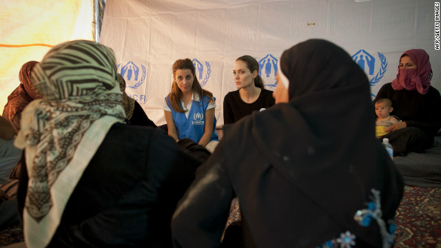 Jolie meets with refugees at the Za'atri refugee camp in Jordan to demonstrate solidarity with Syrian refugees and pay tribute to the Jordanian government for their refugee protection.